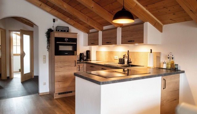 Achentaler Alpentor 54 m² for 2-4 persons, eat-in kitchen, bedroom, shower/WC, balcony, WLAN in Marquartstein